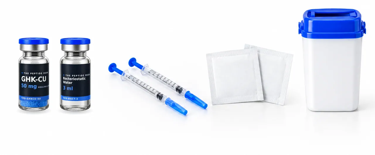 GHK-Cu vial with blue powder and bacteriostatic water at the same size with the black TPD label, next to two U-100 insulin syringes, two alcohol swabs and a sharps container with a blue lid